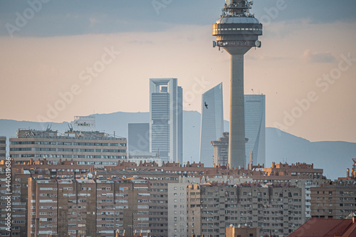 Vistas del edificio de telecomunicaciones de Torre España y Televisión Española, el pirulí, en la ciudad de Madrid en España, durante un día soleado, con las cuatro torres y las torres Kío de fondo. photo