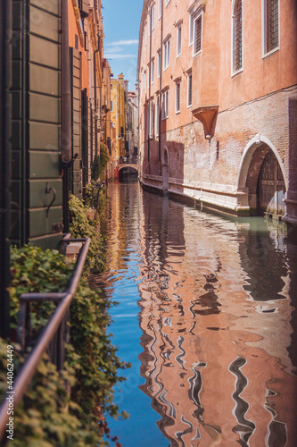 narrow canal in Venice and gandolla photo