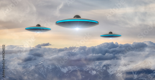 UFO Flying over the Canadian Rocky Mountain Landscape. Art Composite. Alien Visitor Concept. Aerial Background from British Columbia  Canada  near Vancouver.