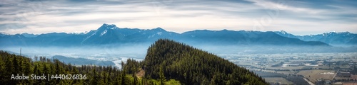 Panoramic View of Fraser Valley from top of the mountain. Canadian Nature Landscape Background. Harrison Mills near Chilliwack, British Columbia, Canada.