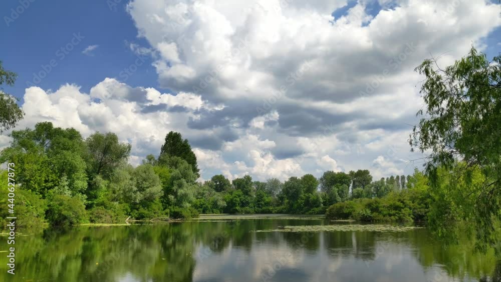 Beautiful Nature Near River At Summer. Scenery River Or Pond In Forest.Summer Time Tranquil Landscape.Calm Lake On Wood.Freshness Peaceful Landmark.Relaxation Sunlight In Park.Leisure Environment. Beautiful Nature Near River At Summer. Scenery River Or Pond In Forest.Summer Time Tranquil Landscape.Calm Lake On Wood.Freshness Peaceful Landmark.Relaxation Sunlight In Park.Leisure Environment.
