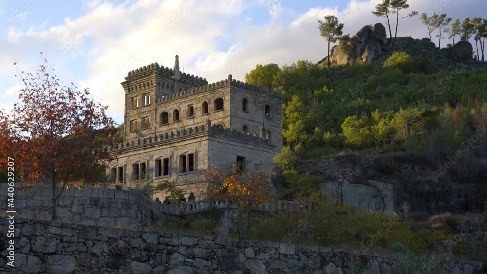 Abandoned ruin building of Termas Radium Hotel Serra da Pena in Sortelha with beautoful colorful trees at sunset, Portugal Abandoned ruin building of Termas Radium Hotel Serra da Pena in Sortelha with beautoful colorful trees at sunset, Portugal