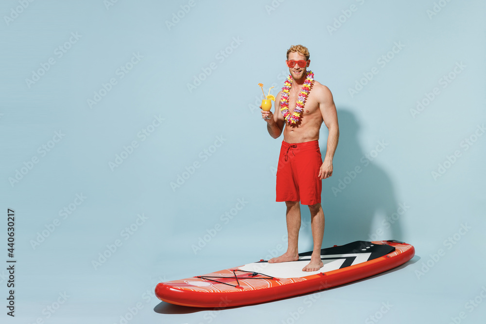 Poster Print Full length young sexy man 20s in red shorts swimsuit hawaii lei glasses stand o 40x26.7 cm