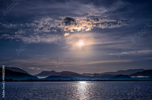 Canvas Print evening sky with clouds and sunshine over ocean