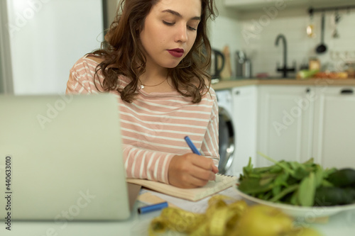 Woman making up diet plan