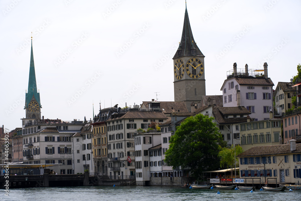 View over the old town of Zurich with churches Fraumünster (German, translation is Women's Minster), and St. Peter at summer day. Photo taken June 20th, 2021, Zurich, Switzerland.