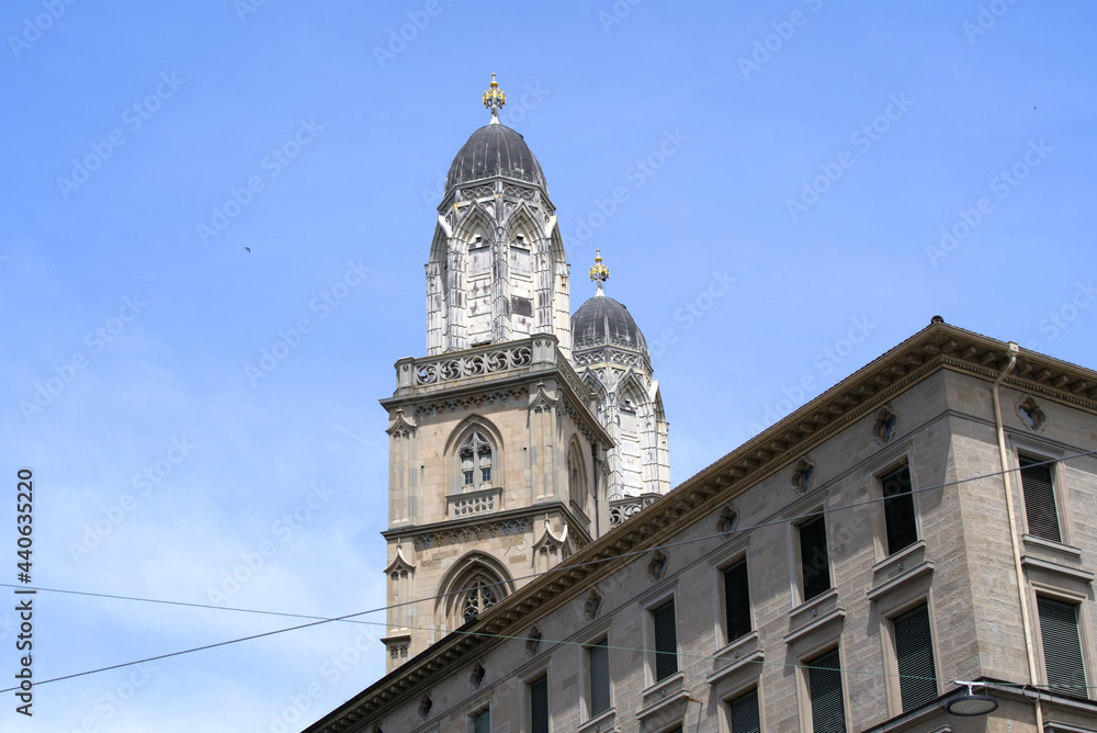 Twin tower of church Grossmünster (Great Minster) at the old town of Zurich on a beautiful sunny summer day. Photo taken June 20th, 2021, Zurich, Switzerland.