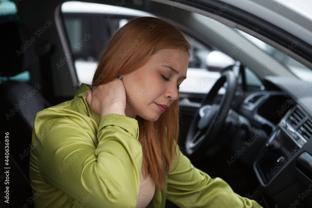 Young woman having neck pain or whiplash injury after car accident - obrazy, fototapety, plakaty 