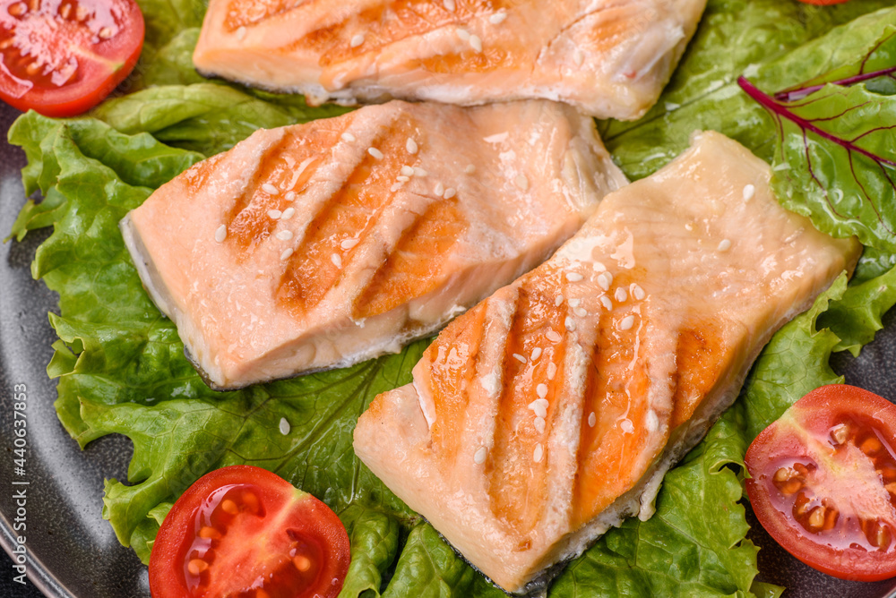 Delicious fresh salad with fish, tomatoes and lettuce leaves Delicious fresh salad with fish, tomatoes and lettuce leaves