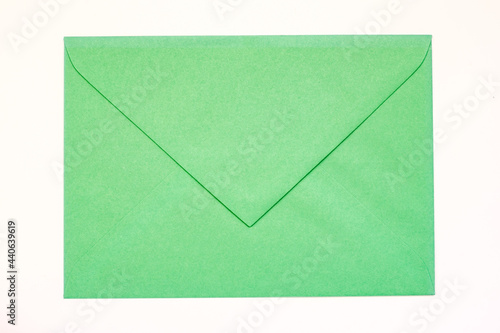 green vintage paper envelope isolated on the white
