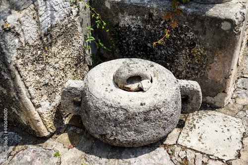 Old stone pot. Made by hand stone garden decoration.