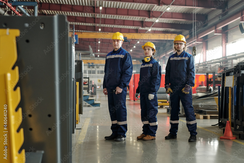 Fototapeta premium Workers of compressor plant standing in row