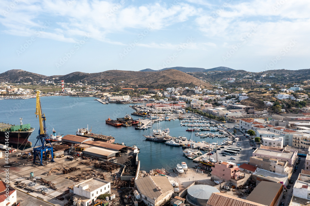Syros island, Greece, aerial drone view. Saiboats moored at Ermoupolis port dock, yachts marina.