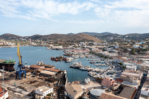 Syros island, Greece, aerial drone view. Saiboats moored at Ermoupolis port dock, yachts marina. photo