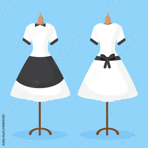 The maid uniform is seen from the back and front hanging on a mannequin.