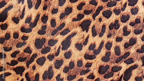 Abstract exotic background, genuine leather, pattern Jaguar, leopard, ocelot skin. Texture, copy space. Concept of shopping, manufacturing