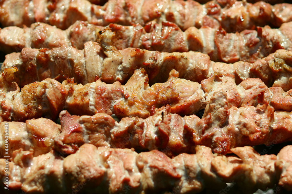 Meat cooked on skewers on the grill, barbecue in nature Meat cooked on skewers on the grill, barbecue in nature
