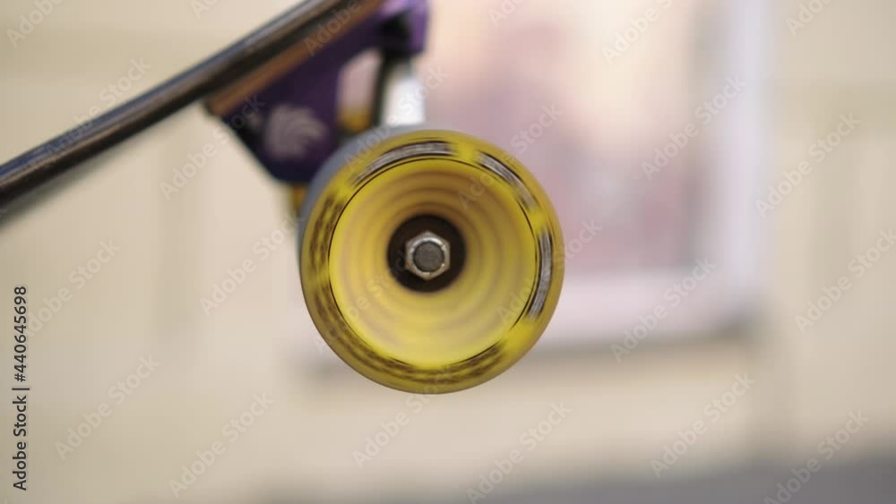 Skateboard wheel spinning against the background of the city Skateboard wheel spinning against the background of the city