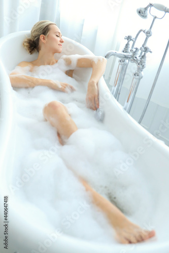 Woman in a bathtub © racool_studio