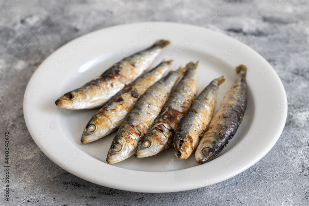 fried sardines on white dish fried sardines on white dish