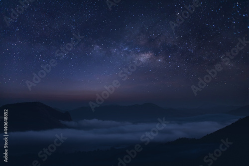 Milky way galaxy at night. Image contains noise and grain due to high ISO. Image also contains soft focus and blur. The Milky Way is our galaxy.  © kanpisut