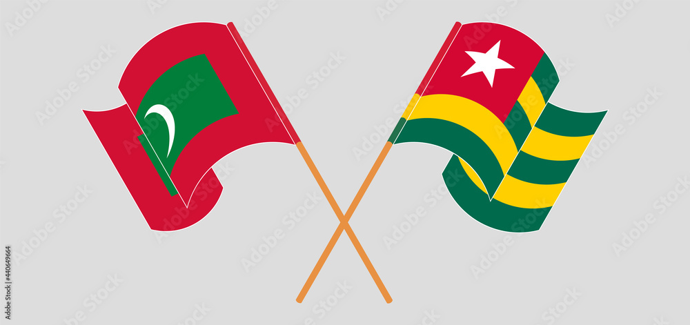 Crossed and waving flags of Maldives and Togo Crossed and waving flags of Maldives and Togo