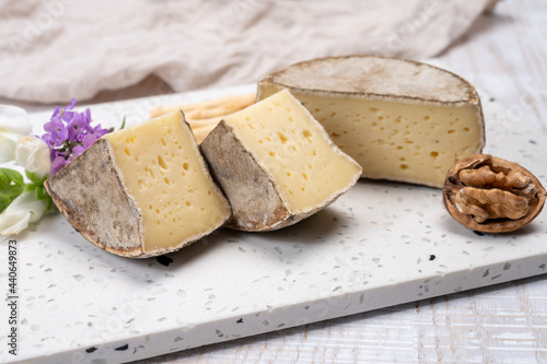 Cheese collection, matured cow cheese with mold tommette de savoie from France, cheese made in Alpine mountains