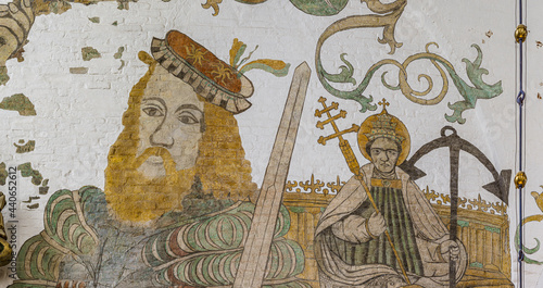 a knight holding a sword and Pope Clement with the triple cross, ancient mural in Aarhus cathedral