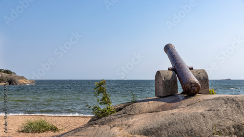 Old cannons left to coastline to remind of military past of Hanko, Finland.