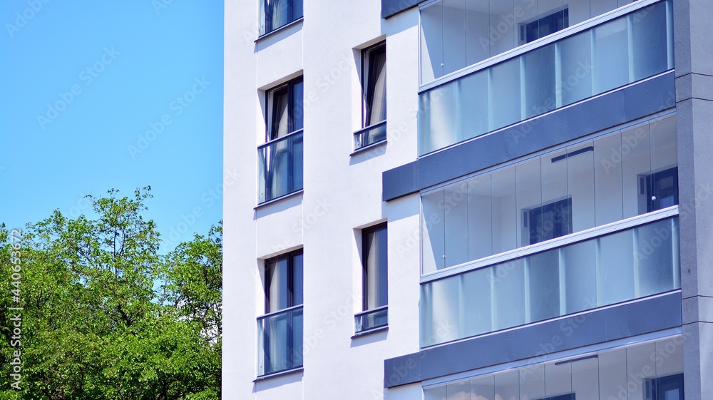 Eco architecture. Green tree and apartment building. The harmony of nature and modernity.