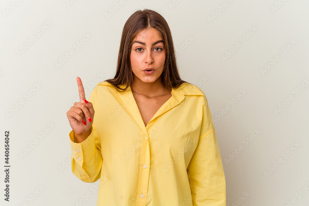 Young caucasian woman isolated on white background smiling cheerful showing number five with fingers. Young caucasian woman isolated on white background smiling cheerful showing number five with fingers.