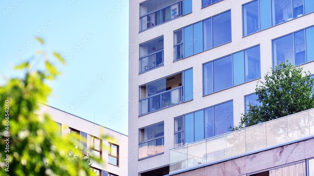 Eco architecture. Green tree and apartment building. The harmony of nature and modernity. Eco architecture. Green tree and apartment building. The harmony of nature and modernity.