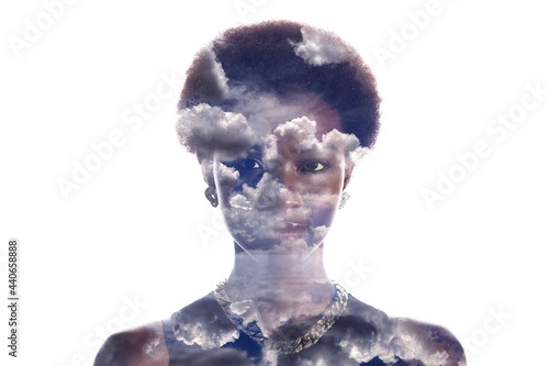 Multiple exposure image with clouds and sky inside african american woman portrait. Mental health and calm concept.