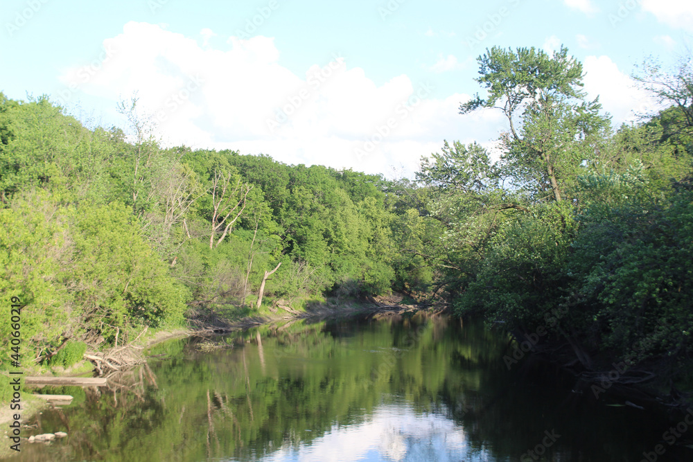 Des Plaines River at early evening at Dam Number 4 Woods in Park Ridge, Illinois Des Plaines River at early evening at Dam Number 4 Woods in Park Ridge, Illinois