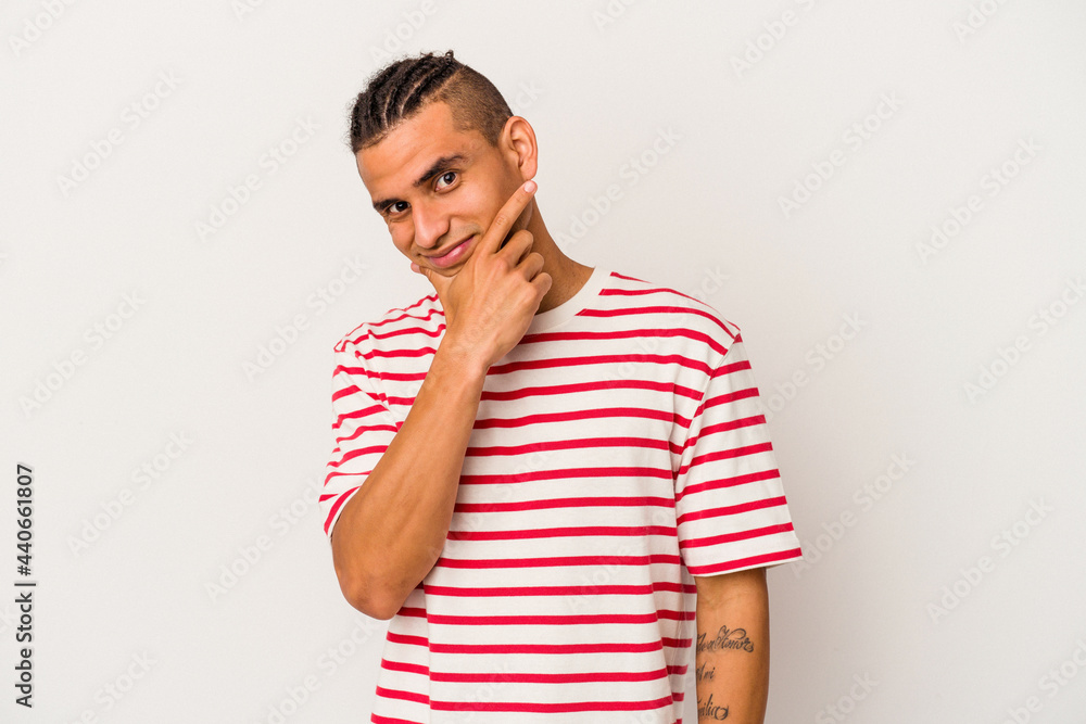 Young venezuelan man isolated on white background contemplating, planning a strategy, thinking about the way of a business. Young venezuelan man isolated on white background contemplating, planning a strategy, thinking about the way of a business.