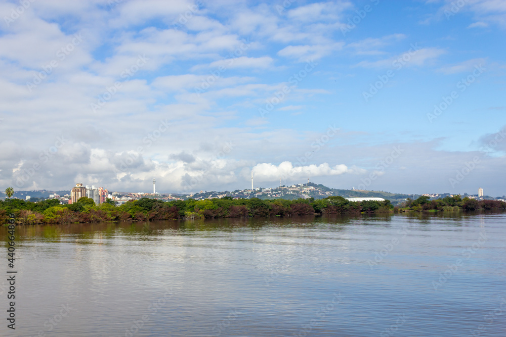 South area of the city with Guaiba lake, vegetation and buildings