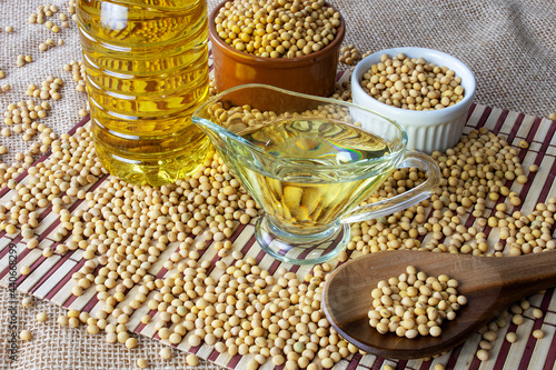 soy oil with soy beans on the table photo