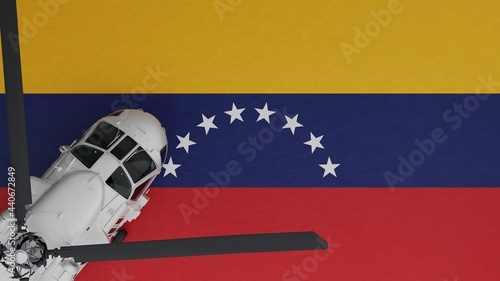 Top down view of a White Helicopter in the Bottom Left Corner and on top of the National Flag of Venezuela © Global Image Archive