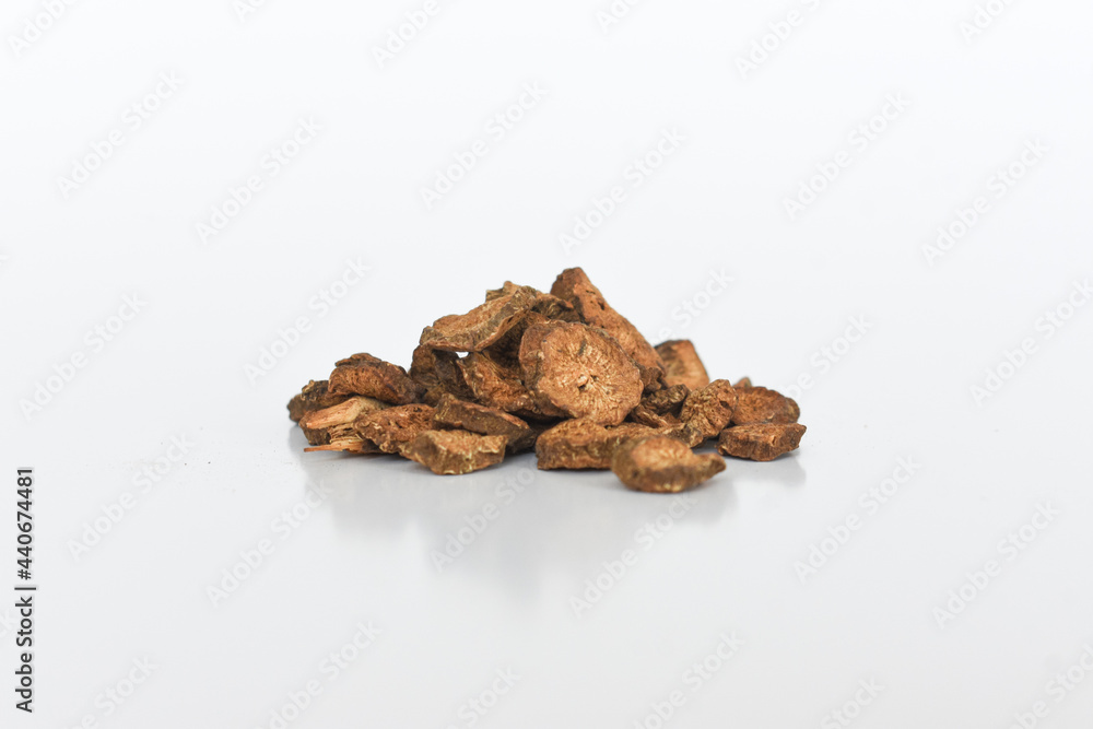 Obraz premium Dried burdock roots (arctium) on isolated white background
