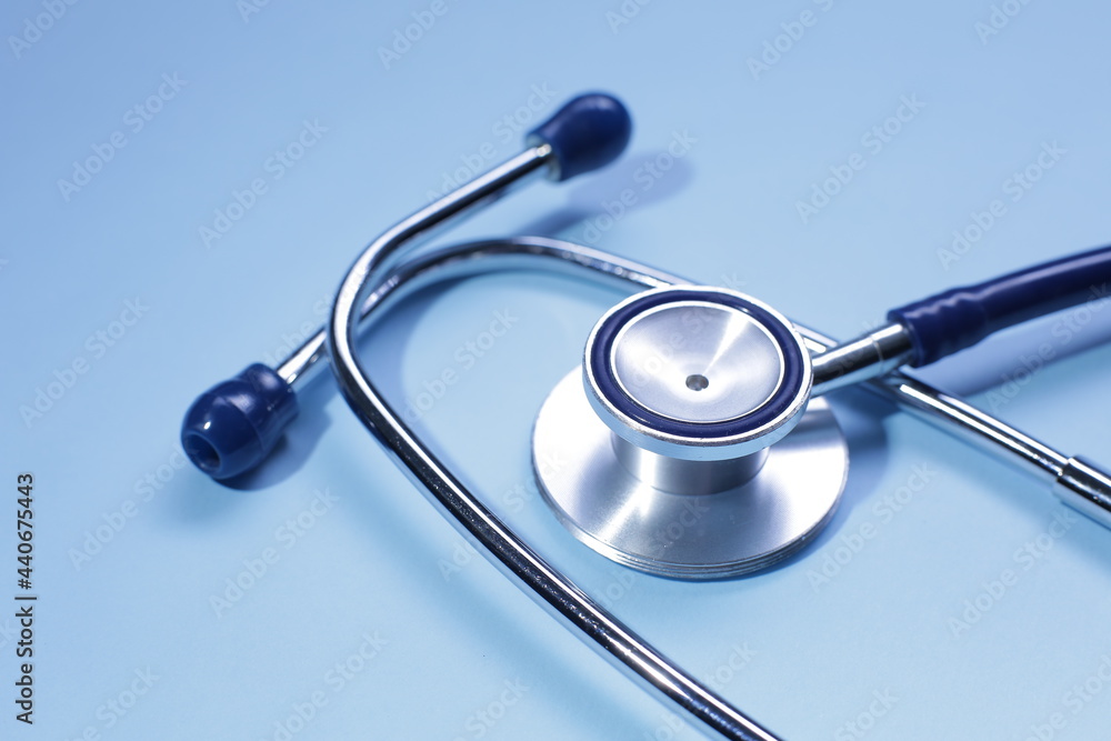 Blue medical stethoscope isolated on blue background Blue medical stethoscope isolated on blue background