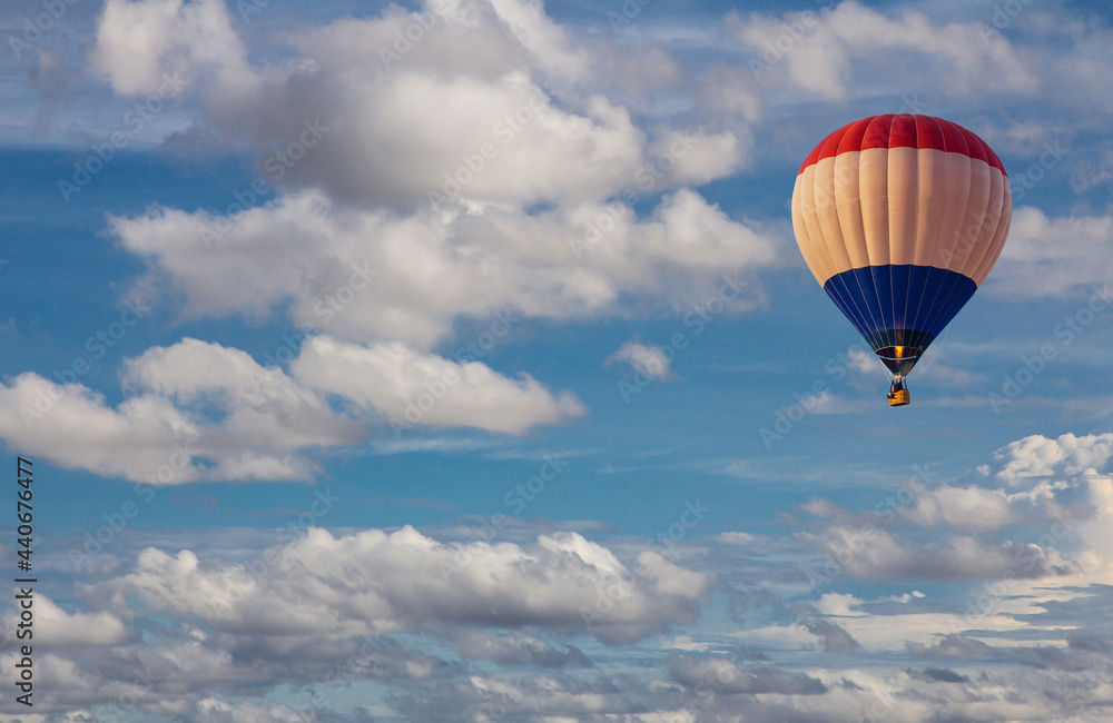 Naklejka premium Aerial view of hot air balloon flying in the blue sky. Scenic view beautiful cloudy blue sky.