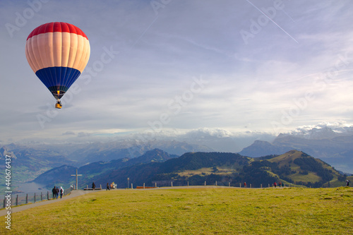 Hot air balloon flying over the Mount Rigi Lucerne, Switzerland
