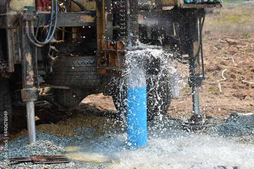 The water flowing artesian well from the land