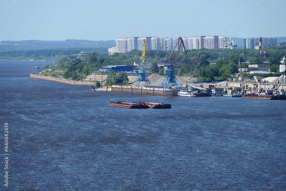 Obraz premium River port. Extraction and transportation of river sand on barges in the summer. High quality photo