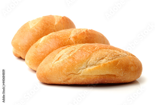 crusty mini baguettes on a white background