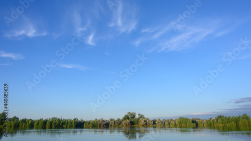 Beautiful sky over river in summer. Morning sunrise, beautiful landscape, foggy sight. Wide format panorama