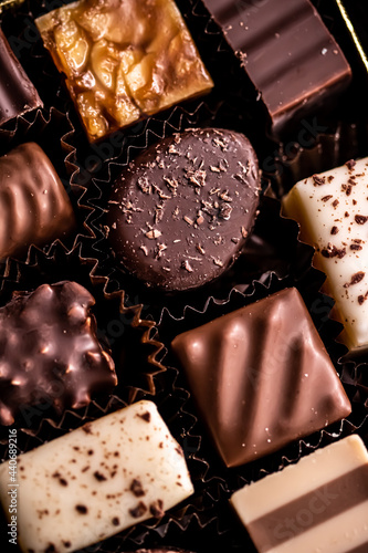 Swiss chocolates in gift box, various luxury pralines made of dark and milk organic chocolate in chocolaterie in Switzerland, sweet dessert food as holiday present and premium confectionery brand. photo