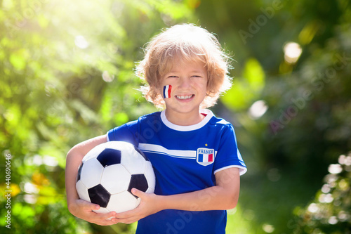 France football fan kids. Children play soccer.