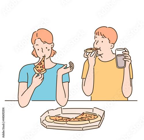 A man and a woman are eating pizza on the table. hand drawn style vector design illustrations. 