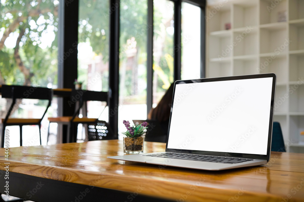 Mock up laptop computer with empty display on wooden table. Mock up laptop computer with empty display on wooden table.